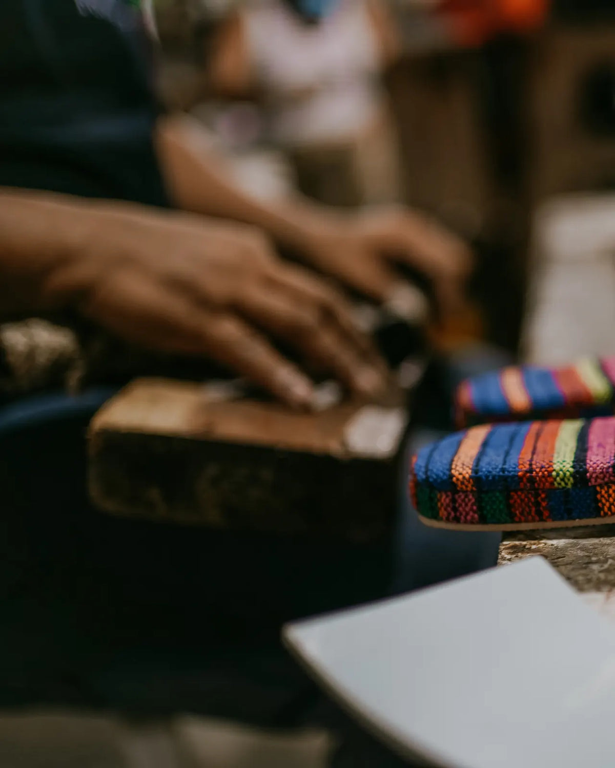 Artisan hands crafting woven shoes in Cairo